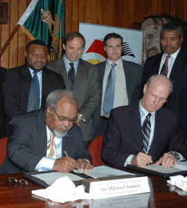 The Prime Minister of Papua New Guinea, the late Right Hon. Grand Chief Sir Michael Somare signing the Papua New Guinea LNG Project Gas Agreement with ExxonMobil et al on 22 May 2008
